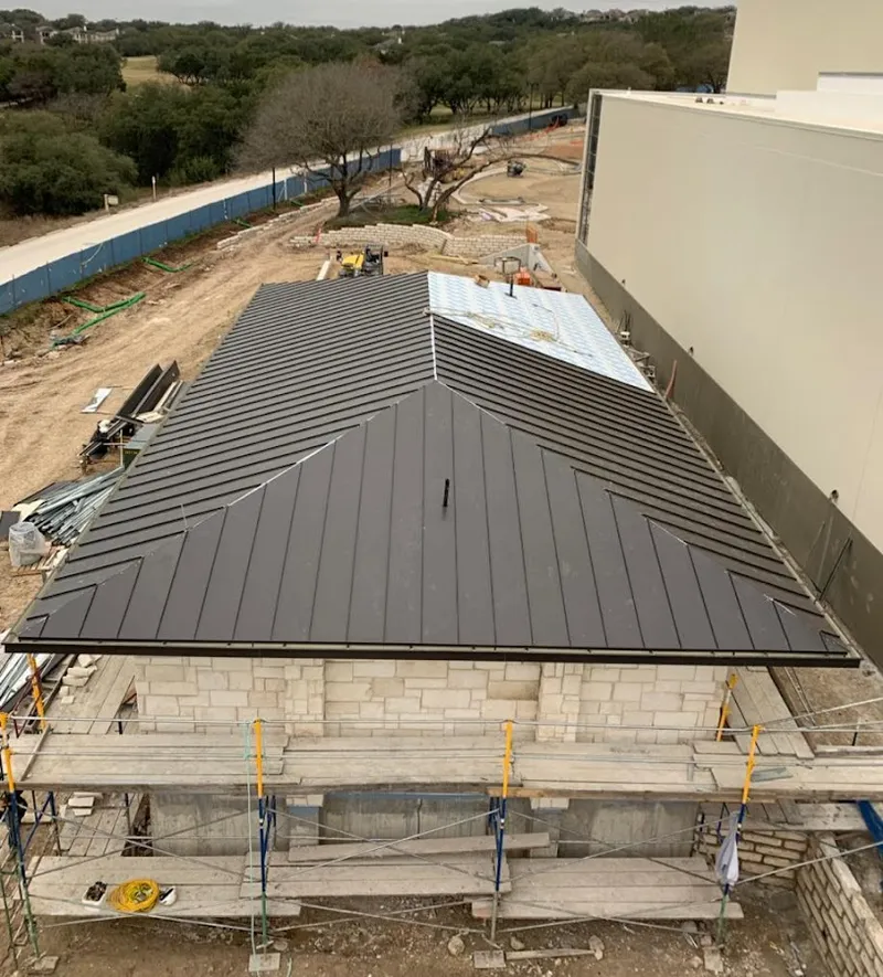 Metal roof new construction with scaffolding in Hampden